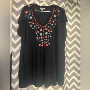 Women’s blouse, tunic length with flowers.